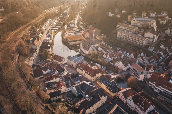 City view with river and buildings in sunlight from a bird's eye view, measurement trip on the new Hermann-Hesse railway with Siemens Mireo Plus B trains, Calw, Germany