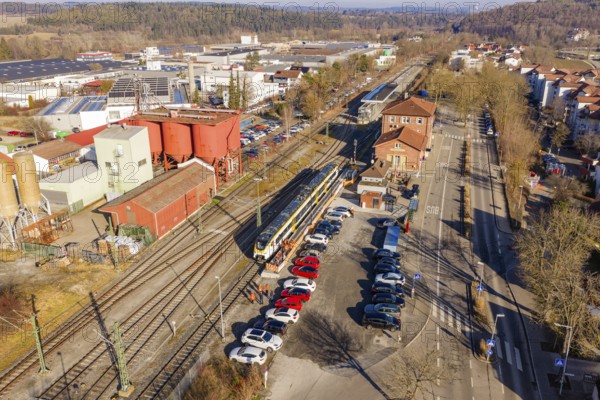 Industrial area with freight yard, parked vehicles and rails, test run on the new Hermann-Hesse railway with Siemens Mireo Plus B trains, Calw, Germany