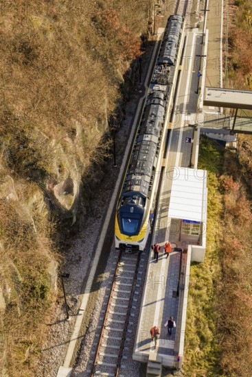 Train stops at a station in the rocky hills, viewed from above, test run on the new Hermann-Hesse railway with Siemens Mireo Plus B trains, Calw, Germany