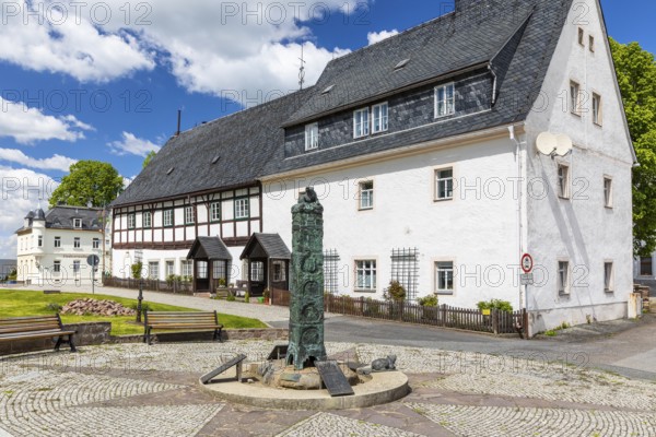 Market fountain with historical column on Bärenstein market square, Altenberg, Saxony, Germany