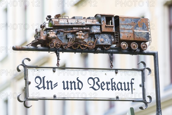 Advertising sign with a model of a steam locomotive for purchase and sale, Chemnitz, Saxony, Germany