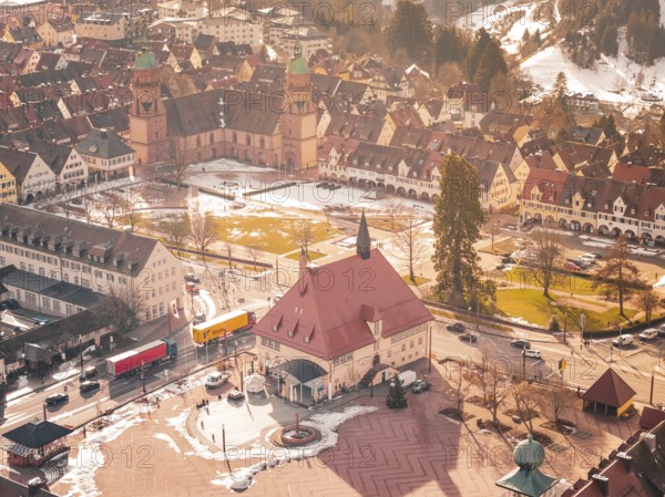 Central square with church and historic buildings in winter, light snow cover available, Freudenstadt, Black Forest, Germany