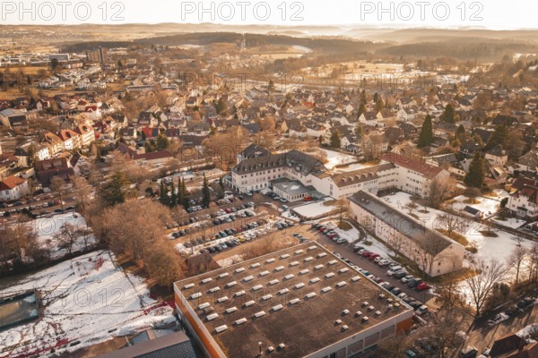 Aerial view of an urban landscape in winter with a variety of buildings and cars, Freudenstadt, Black Forest, Germany