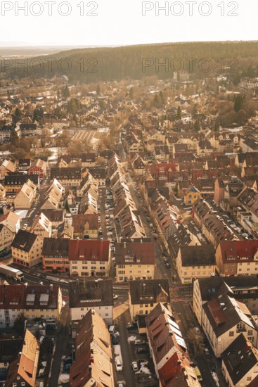 Overview of an urban landscape with densely packed houses and snow-covered roads, Freudenstadt, Black Forest, Germany