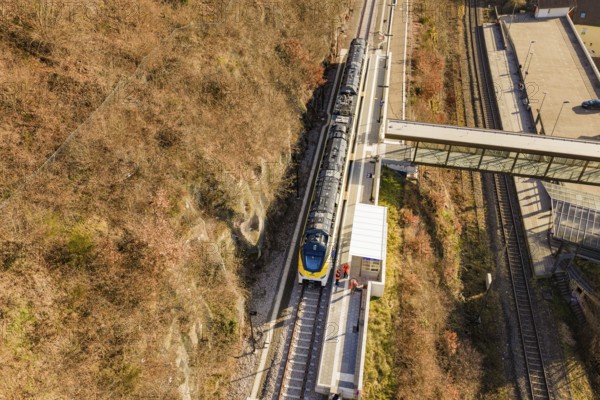 Bird's-eye view of a train station with bridge and autumnal tracks, test run on the new Hermann-Hesse railway with Siemens Mireo Plus B trains, Calw, Germany