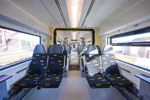 Modern train design with yellow accents and bright window light, test run on the new Hermann-Hesse railway with Siemens Mireo Plus B trains, Calw, Germany
