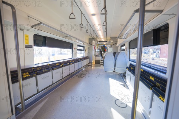 Modern train compartment with bright colors and comfortable seats, large windows and handles for passengers, test run on the new Hermann-Hesse railway with Siemens Mireo Plus B trains, Calw, Germany