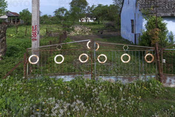 Old garden gate in front of a plot of land in the former Dornfeld from 1789-1939, today Ternopillja, Ukraine