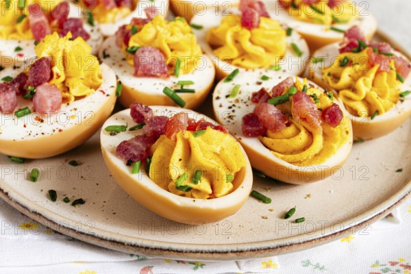 Spicy, stuffed ramen eggs, with bacon and green onions, homemade, no people