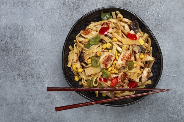 Fried noodles with chicken meat and vegetables, Bami Goreng, Indonesian dish, no people