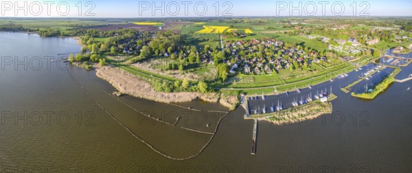 Panoramic aerial view of Dümmer See with marina sailing harbours and holiday homes, Lembruch, Lower Saxony, Germany