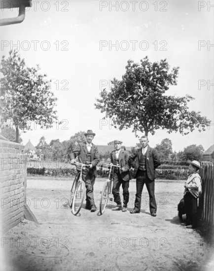 Men with bicycles, cyclists, hat, little boy, ca. 1920-1930, retro, vintage, old, historic, northern Germany