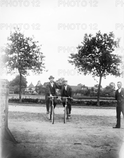 Men with bicycles, cyclists, hat, ca. 1920-1930, retro, vintage, old, historic, northern Germany
