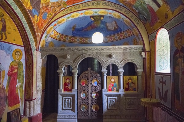 Interior view of an Orthodox chapel with colorful frescoes and icons, Nikorzminda Cathedral, Racha-Lechkhumi region, Lower Svaneti, Georgia