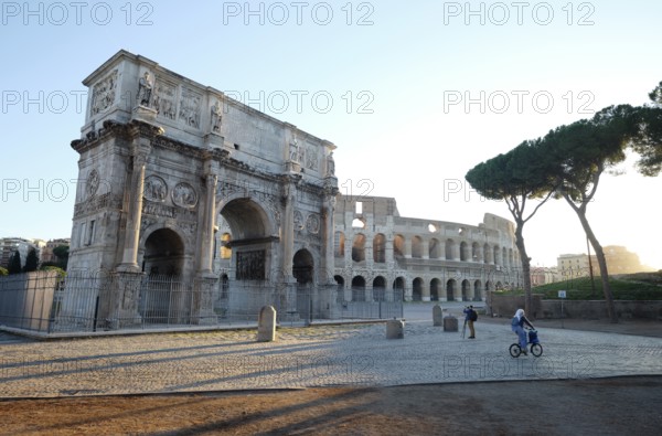 Arch of Constantine and Colosseum at sunrise, Rome, Lazio, Italy