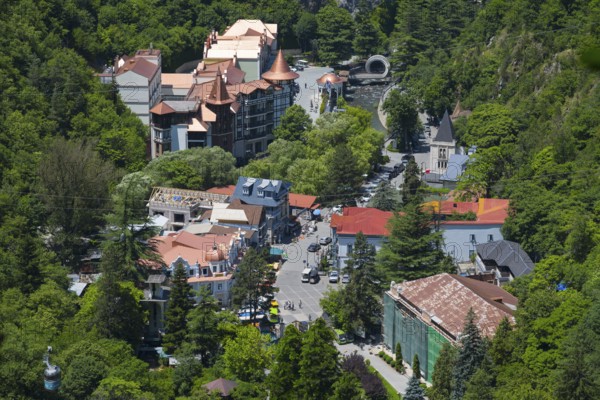 Overview of the city nestled in a green, wooded area with various buildings, Borjomi, Borjomi resort, Borjomi, Samtskhe-Javakheti region, Samtskhe-Javakheti, Lesser Caucasus, Georgia
