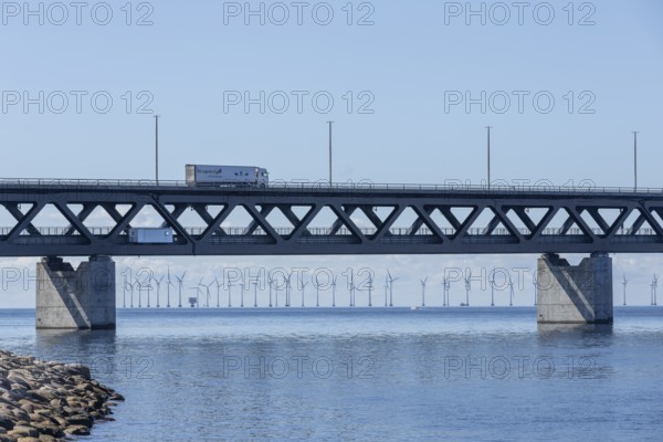 Wind turbines behind the Öresund Bridge, Øresundsbrön, world's longest cable-stayed bridge, connecting Copenhagen with Malmö, Denmark, Sweden