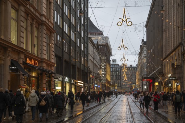 Alexanterinkatu, main shopping street in the city center, designed by Carl Ludwig Engel, with Stockmann department store, Christmas decoration, tram, Helsinki, Finland