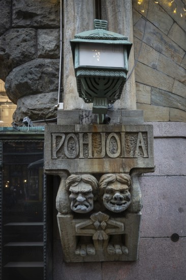 Trolls, stone figures from Kalevala, art nouveau architecture, Pohjola insurance building, Alexanterinkatu, main shopping street in the city center, Helsinki, Finland