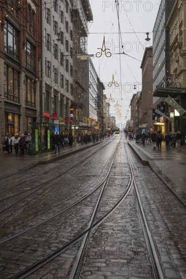 Alexanterinkatu, main shopping street in the city center, designed by Carl Ludwig Engel, Christmas decoration, tram tracks, Helsinki, Finland