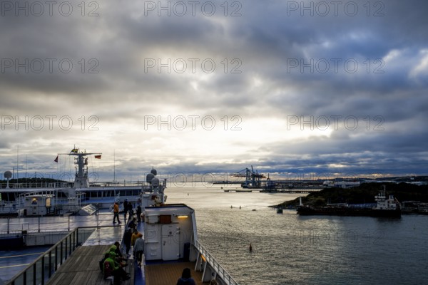 Dramatic sunset over the water with harbor and ships, taken by the Stena Line Göteborg-Kiel ferry, Göteborg, Västra Götalands län, Sweden