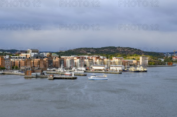 Panorama of a harbor with municipal buildings and cloudy sky in the background in Gothenburg, Stena Line Göteborg-Kiel, Göteborg, Västra Götalands län, Sweden