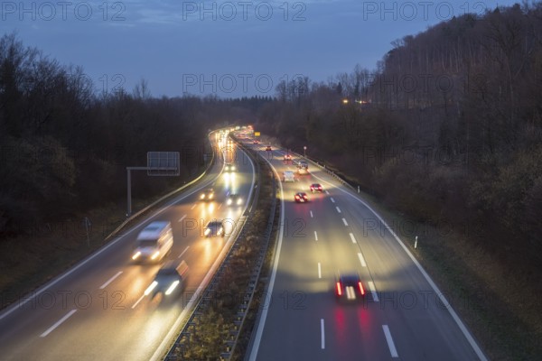 Long-exposure view of a busy highway at night, stars and lights in front of an evening sky, near Stuttgart, Baden-Württemberg, Germany