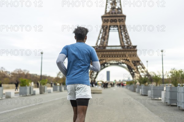 Person jogging on a parisian street with the iconic eiffel tower in the background, promoting urban fitness, healthy lifestyle, and exploring the city while exercising
