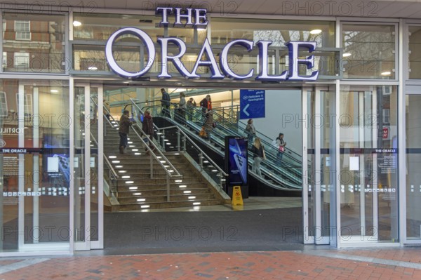 Shoppers inside The Oracle shopping centre, town centre of Reading, Berkshire, England, UK