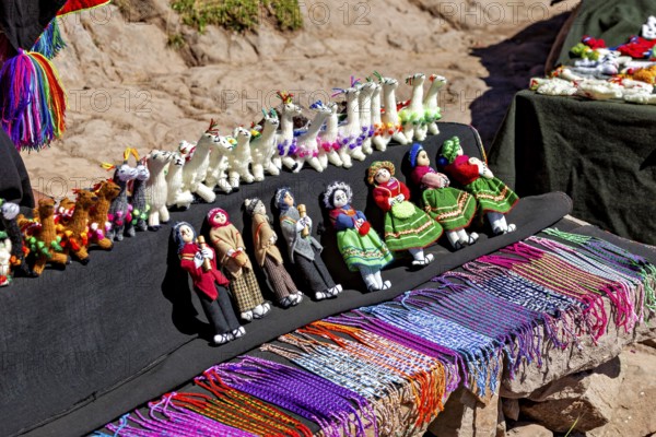 Handmade dolls and animals in traditional clothing at a souvenir market in Peru, souvenirs and mementos on the island of Taquile in Lake Titicaca in Peru