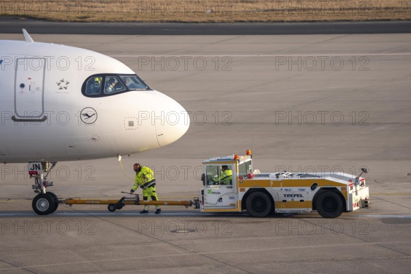 Lufthansa City Airbus A320neo is pushed from the gate onto the taxiway, ready to go, to Cologne/Bonn Airport, CGN, North Rhine-Westphalia, Germany