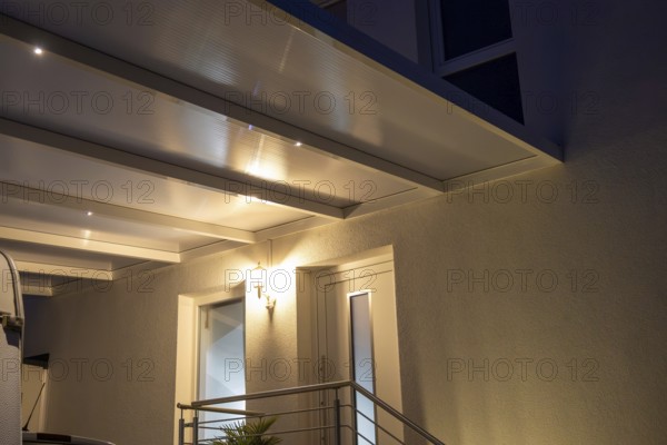 Modern entrance canopy with integrated LED lighting for an inviting house entrance