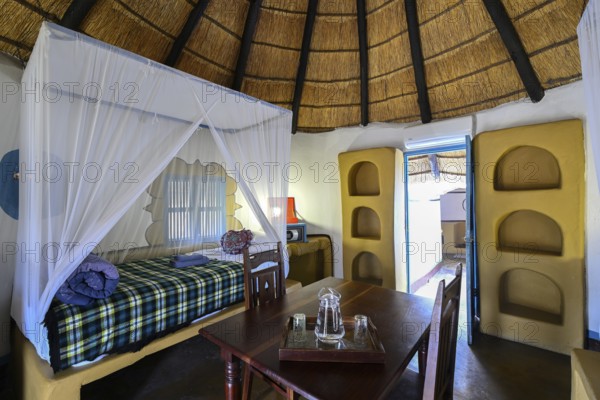 Round cabin, guest accommodation, Planet Baobab, lodge near the village of Gweta, interior view, Makgadikgadi Pans National Park, Central District, Botswana