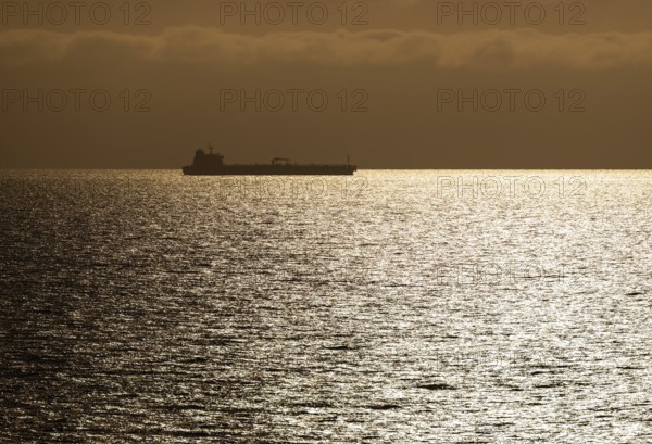 Silhouette, cargo ship, evening light, Baltic Sea