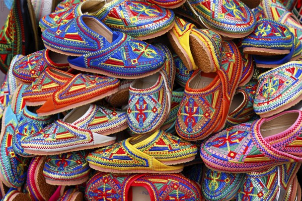 Sales stand with traditional colorful slippers at a market in Marrakech, historic old town, Medina, UNESCO World Heritage Site, Morocco