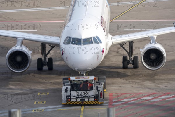 Eurowings Airbus is pushed from the gate onto the taxiway, ready to go, to Cologne/Bonn Airport, CGN, North Rhine-Westphalia, Germany