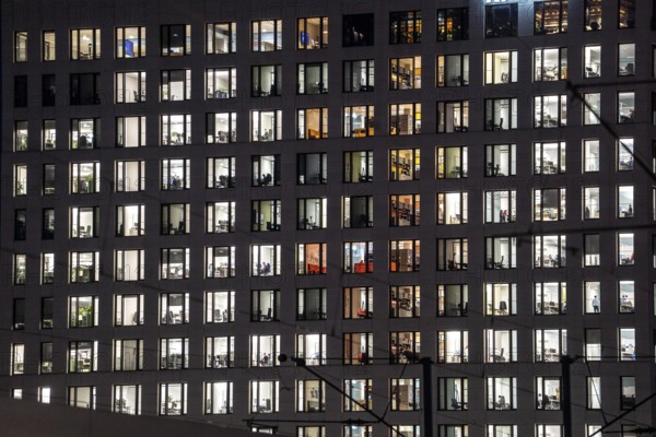 Office building, many windows are illuminated, Cologne, North Rhine-Westphalia, Germany