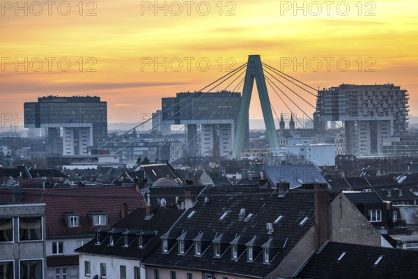 View over the city center of Cologne, residential buildings in Cologne-Deutz in front, pillar of the Severin Bridge, across the Rhine, crane houses in Rheinauenhafen, North Rhine-Westphalia, Germany