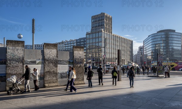 Wall segment, tourists and passers-by at Potsdamer Platz, Berlin, Germany