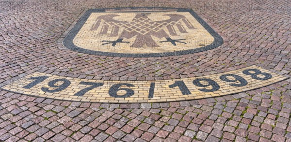 Brandenburg coat of arms on paving stone, sidewalk in front of the Brandenburg Gate in Potsdam, Brandenburg, Germany