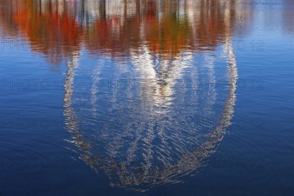 The Montreal Observation Ferris Wheel reflected in Bassin Bonsecours in autumn, Old Port of Montreal, Quebec, Canada. George Ferris (1859–96), is the American engineer who invented the ferris wheel