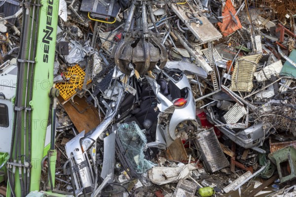 Scrap trade in a commercial port. A disused small car is scrapped. Mannheim, Baden-Württemberg, Germany