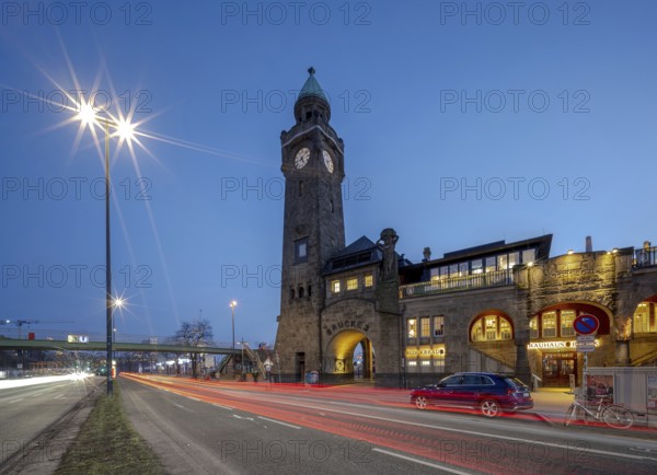 Hamburg piers with water level tower at night and traffic light trails, Hamburg, Germany