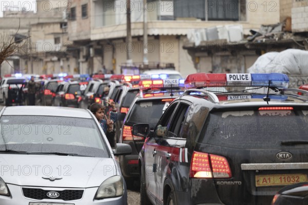 In Al Tabqah, Syria on January 18, 2026, a convoy of Syrian Government forces deploys throughout the city following the withdrawal of SDF forces. Local civilians are seen gathering in the streets to welcome the troops with celebrations, marking the return of government control to this strategic city in northeast Syria, Raqqa, Tabqah, Syria