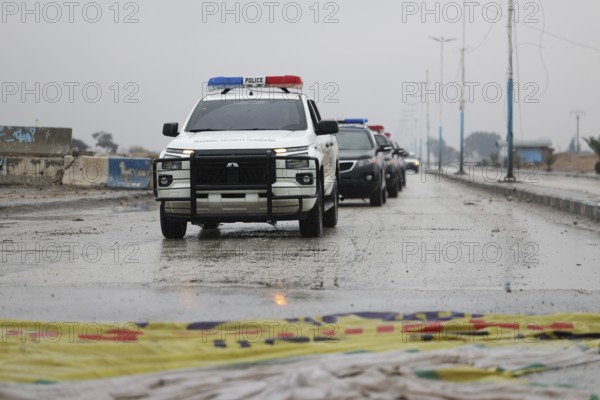 In Raqqa, Syria on January 18, 2026, a convoy of Syrian Government forces is seen advancing through the region, treading over flags of the Syrian Democratic Forces (SDF). This movement comes as government troops successfully take control of dozens of towns and villages across Northeast Syria following the withdrawal of Kurdish-led groups affiliated with the PKK, Raqqa, Tabqah, Syria