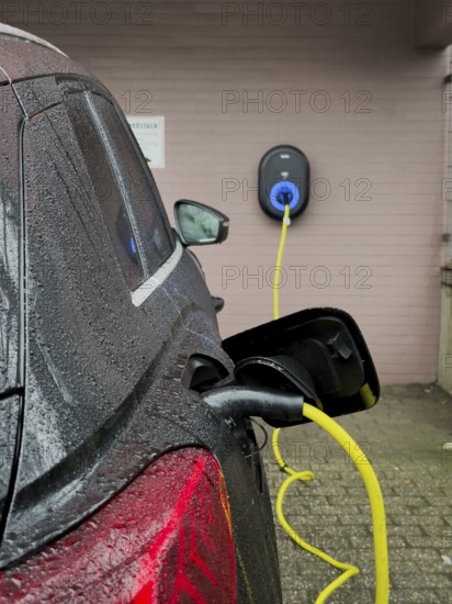 An e-car is charged at a wallbox, Wuppertal, Germany