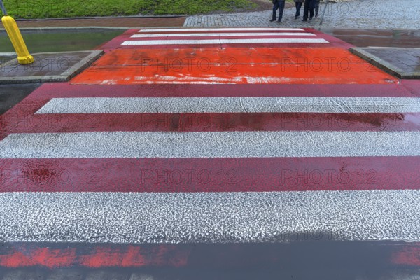 Zebra crossing marked in red and white, Krakow, Poland