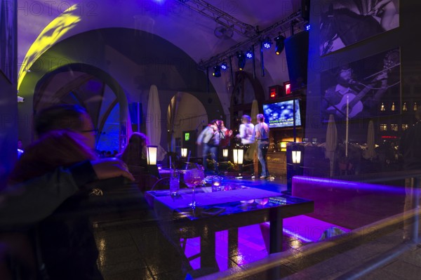 View of a karaoke bar at night, Krakow, Poland