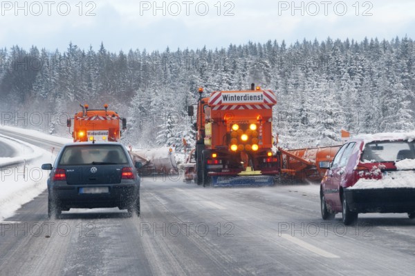Winter maintenance, snowplow, spreader on snowy highway, Upper Bavaria, Germany