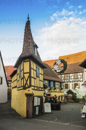 Christmassy decorated houses and alley with half-timbered houses, Christmas market, Eguisheim, Haut-Rhin department, Grand Est region, Alsace, France